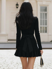 Elegant Black Knitted Mini Skirt With Gold Buckle Detail