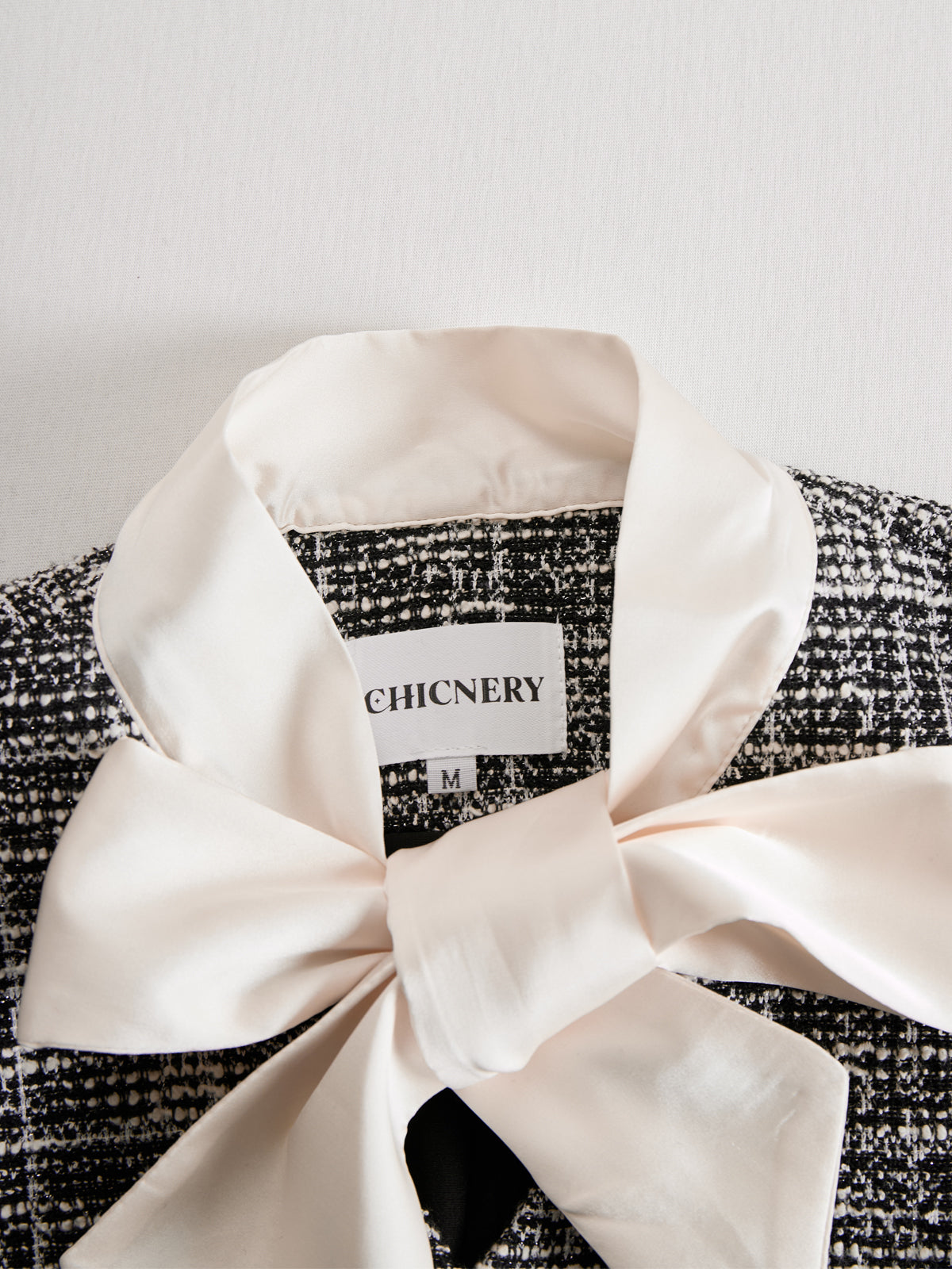 Chicnery Satin Bow Tie Black Tweed Bell-sleeves Top And Pleated Skirt Suits